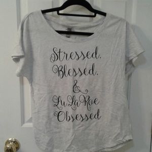 Medium stressed blessed and lularoe obsessed top
